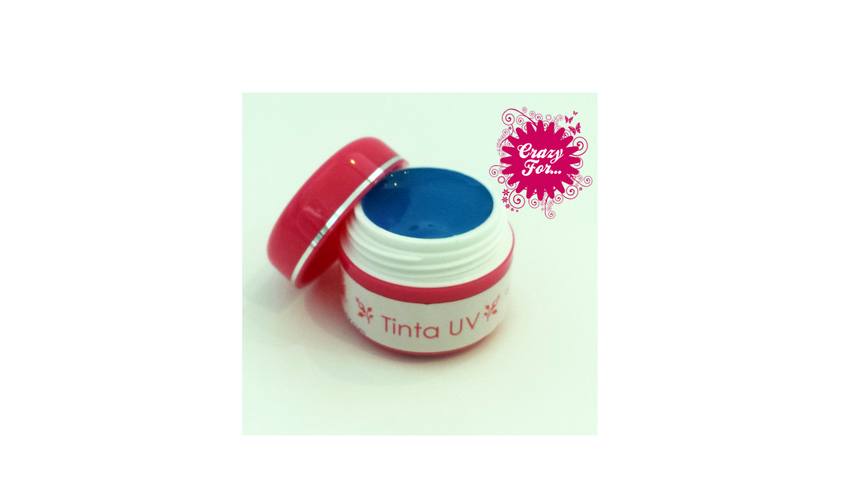 Frasco aberto de tinta UV azul com tampa vermelha e logo Crazy Face ao fundo