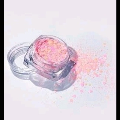 Pote de maquilhagem com pó rosa solto