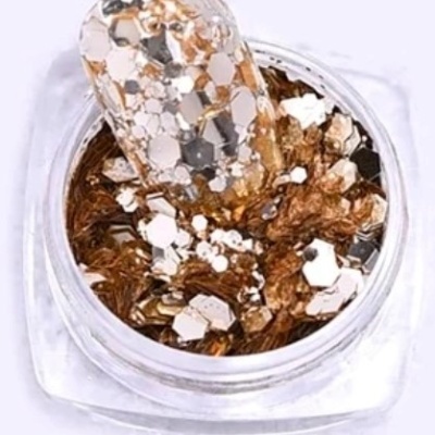 Brilhos hexagonais dourados e prateados em pote transparente para decoração de unhas