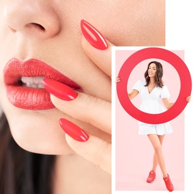 Mulher com batom e unhas vermelhas segurando círculo vermelho