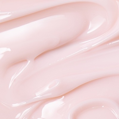 Creme rosa claro de textura cremosa e lisa sobre fundo neutro