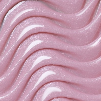 Textura brilhante e ondulada de gel ou creme cor-de-rosa