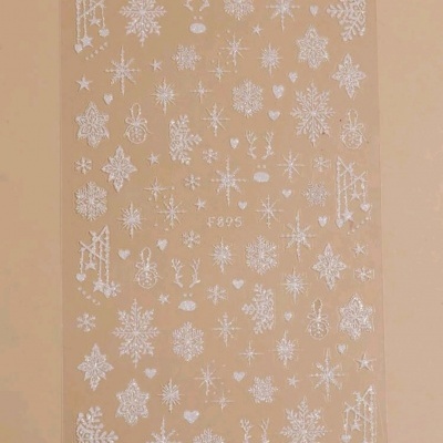 Folha transparente com autocolantes brancos de flocos de neve e renas