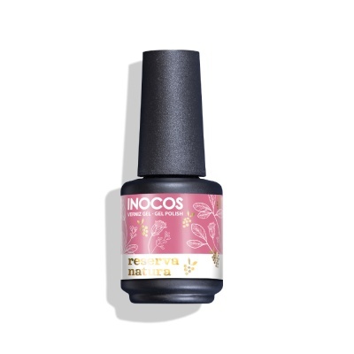 Frasco de verniz gel INOCOS reserva natura com rótulo rosa, branco e dourado e tampa preta.