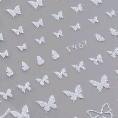 Autocolantes de borboletas brancas com brilho sobre fundo cinzento