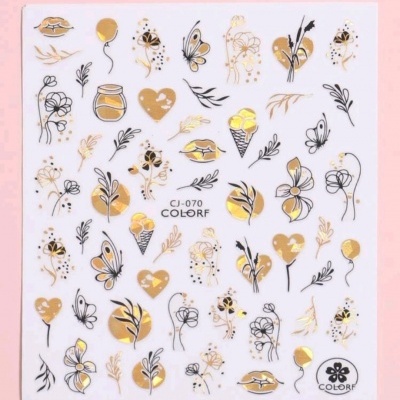 Folha branca com autocolantes decorativos em preto e dourado