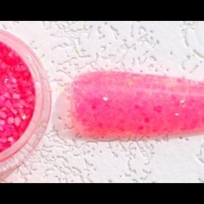 Frasco pequeno de glitter rosa e unha postiça estilete com glitter