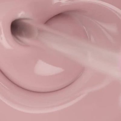 Textura cremosa rosa a ser misturada com pincel.