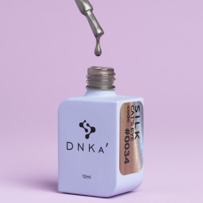 Frasco de verniz de unhas DNKA prateado com conta-gotas e rótulo SILK CATS EYE