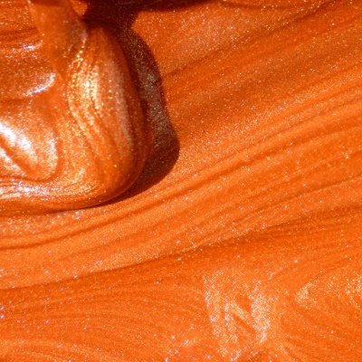 Massa laranja brilhante com textura cintilante