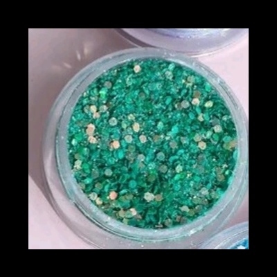 Recipiente redondo transparente com purpurina verde e reflexos dourados