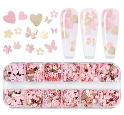 Pequenas peças decorativas para unhas em rosa, dourado e bege, em caixa transparente.