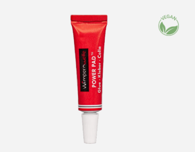 Tubo vermelho de cola Winner Valle Power Pad com tampa branca e símbolo VEGAN verde ao lado.