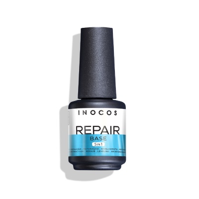 Frasco de verniz INOCOS Repair Base 5in1 com rótulo branco e azul numa superfície branca.