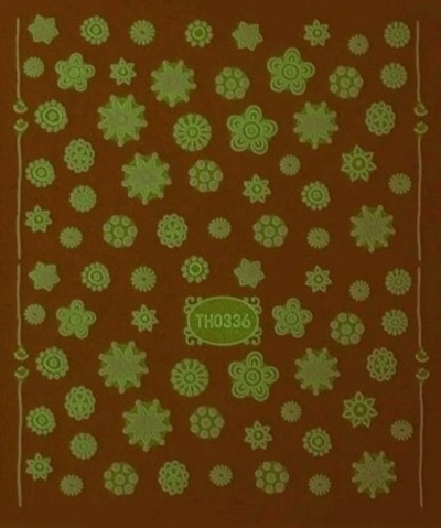 Folha de adesivos florais verdes em fundo castanho com texto TH0336