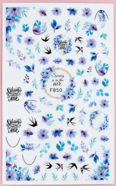 Folha de autocolantes com flores azuis e roxas, folhas e texto 'Spring is in the AIR'