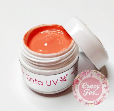 Pote aberto de tinta UV laranja com tampa branca e etiqueta personalizada