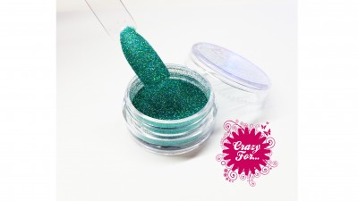 Pote de glitter verde-azulado metálico com pincel e selo rosa 'Crazy For...'