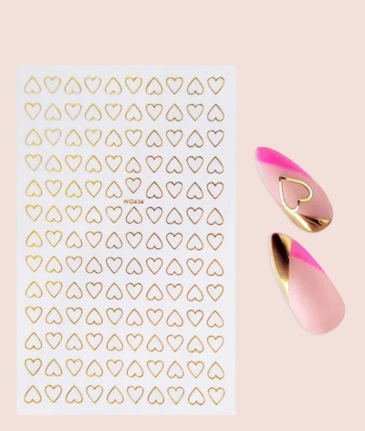 Autocolantes dourados em forma de coração e unhas artificiais rosa com detalhes dourados