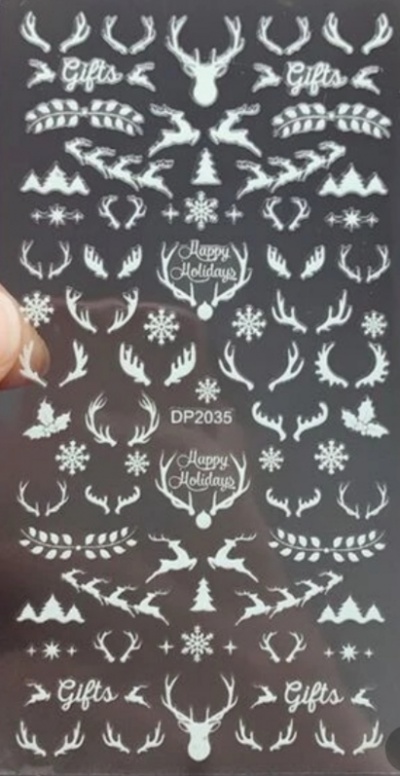 Folha de decalques brancos com temas natalícios sobre fundo preto