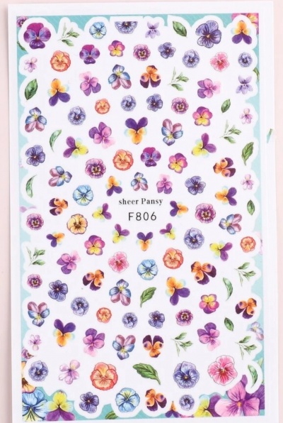 Folha branca com estampas pequenas de flores coloridas e texto central