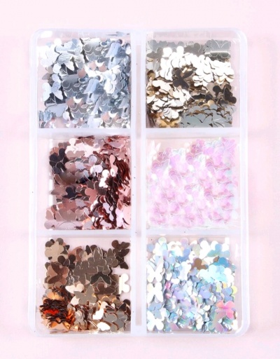 Caixa transparente com seis compartimentos contendo brilhantes metálicos coloridos