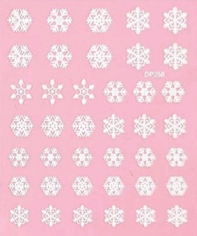 Autocolantes brancos de flocos de neve em fundo rosa