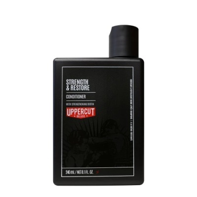 Condicionador Strength & Restore UPPERCUT Deluxe em embalagem preta de 240 ml
