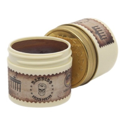 Pote de pomada para cabelo aberto com tampa ao lado e etiqueta vintage