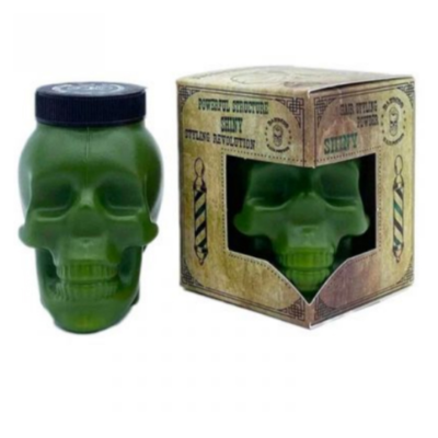 Frasco verde em forma de caveira e embalagem associada