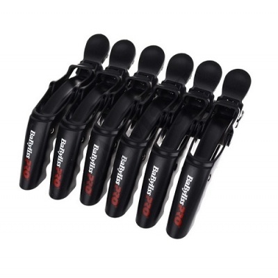 Seis molas de cabelo BaByliss PRO pretas alinhadas sobre fundo branco