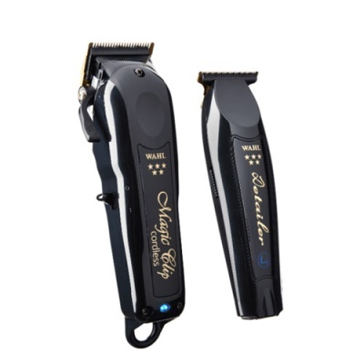 Dois cortadores de cabelo elétricos Wahl pretos com detalhes dourados