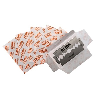 Lâminas de barbear ELAMS INOX em embalagens individuais de papel branco com texto laranja.