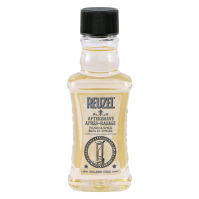 Frasco transparente de aftershave Reuzel com rótulo creme e tampa preta