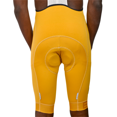 calções de ciclismo amarelos com almofadado circular na parte traseira