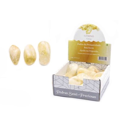 pedras semi-preciosas citrino amarelas em caixa de exposição branca e cinza
