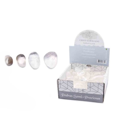 pedras semi-preciosas roladas de diferentes cores junto de caixa com pedras e texto