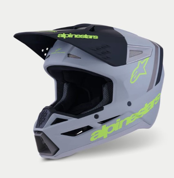 Alpinestars SM3 Radium Cinza Capacete de motocrosse cinza e preto com texto verde fluorescente alpinestars