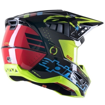 Capacete integral colorido para motociclismo com padrões e visor protetor.