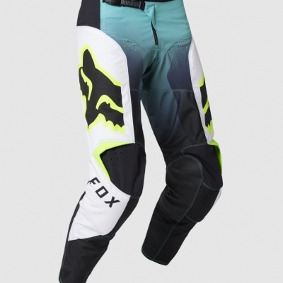 Calças motocross da marca FOX em azul, branco, preto e amarelo neon.