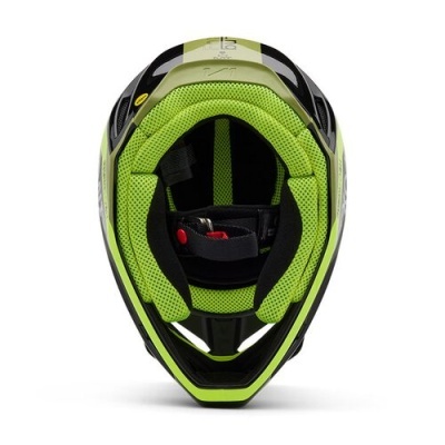 Capacete de motociclismo preto e verde visto de cima