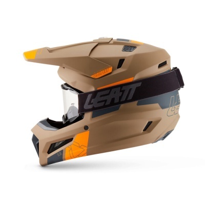 Capacete de motocross marron com viseira transparente e cinta elástica preta com texto LEATT