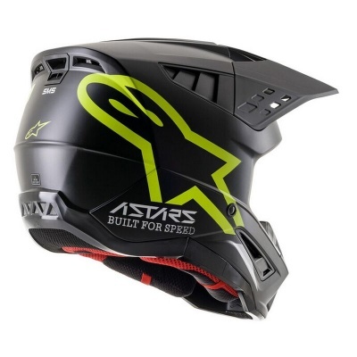Capacete preto com detalhes em verde lima e texto ASTARS BUILT FOR SPEED
