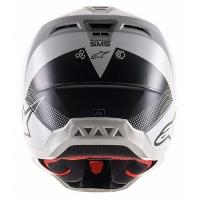 Capacete integral branco e preto com detalhes geométricos e acolchoado vermelho