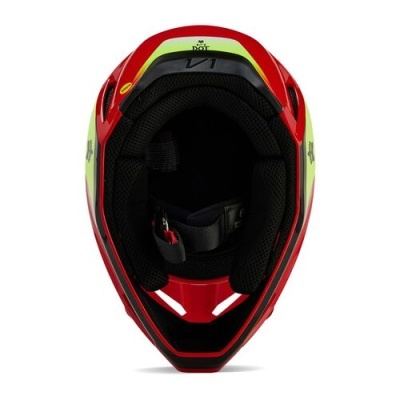 Capacete de motociclista vermelho, preto e verde fluorescente visto de cima