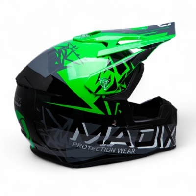 Capacete de motocross verde, preto e cinza com padrões geométricos e texto MAJDX PROTECTION WEAR