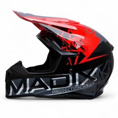 Capacete integral para motocross preto e vermelho com padrões geométricos e texto MADIX PROTECTION WEAR