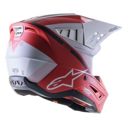 Capacete motocross vermelho e branco com viseira e detalhes pretos