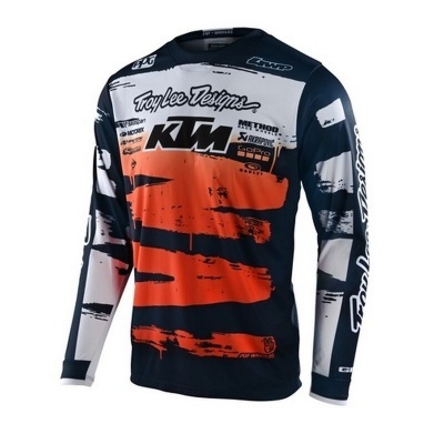 Camisola motocross preta, branca e laranja com logótipos Troy Lee Designs e KTM
