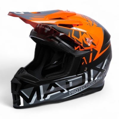 Capacete motocross preto, cinza e laranja com grafismos e texto MADIX PROTECTION WEAR